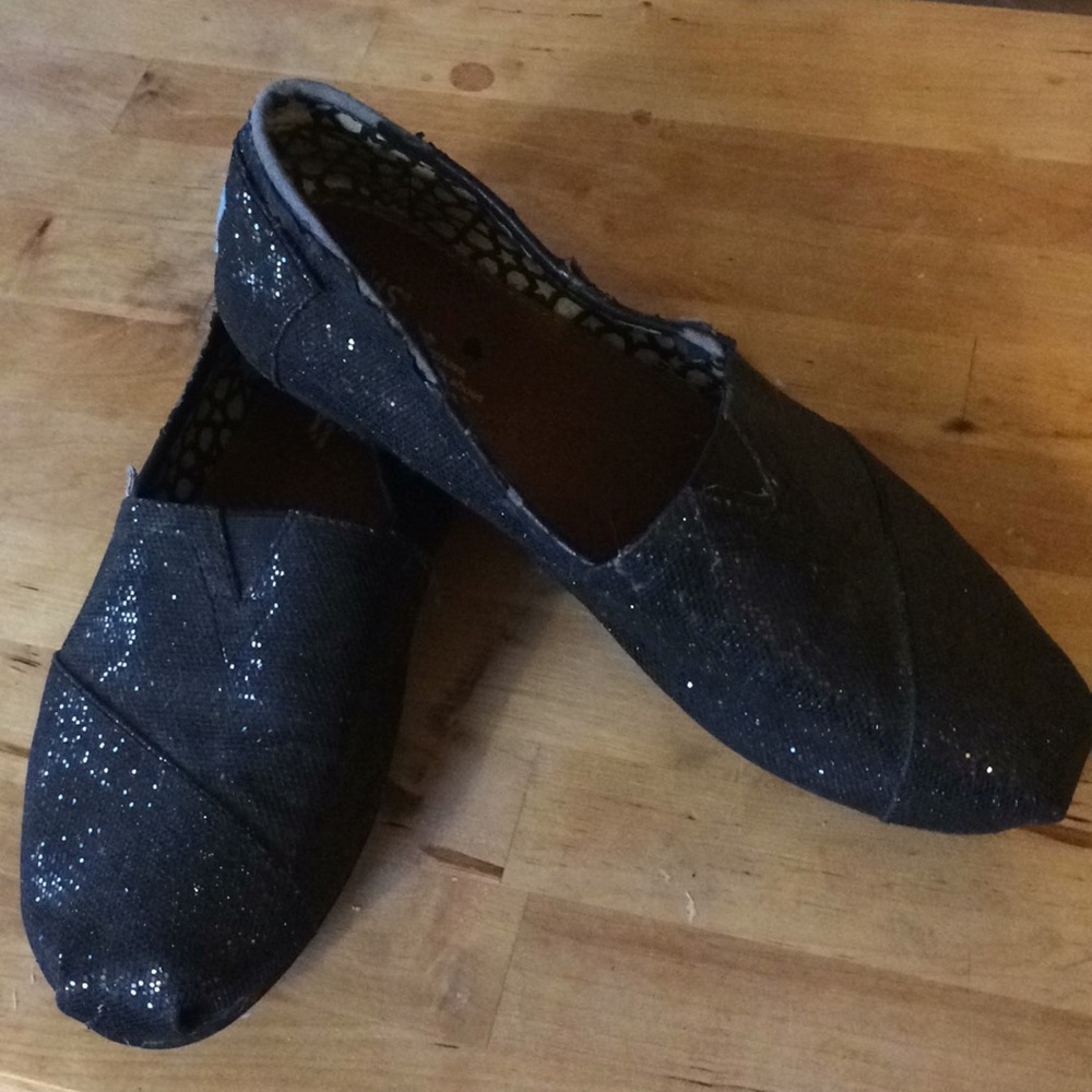 Sparkly black Tom’s slip-on shoes